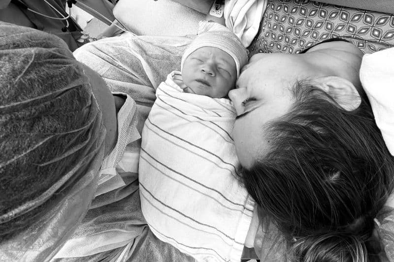 Mother and newborn sharing a peaceful moment in the hospital.